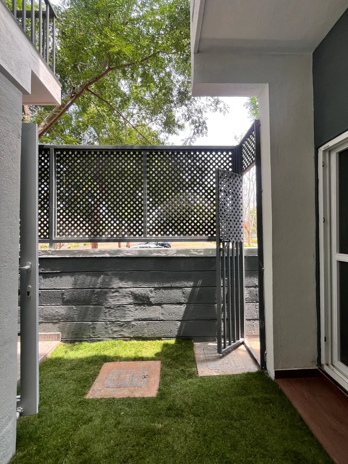 Grey Green Block, Mysuru — screened garden courtyard