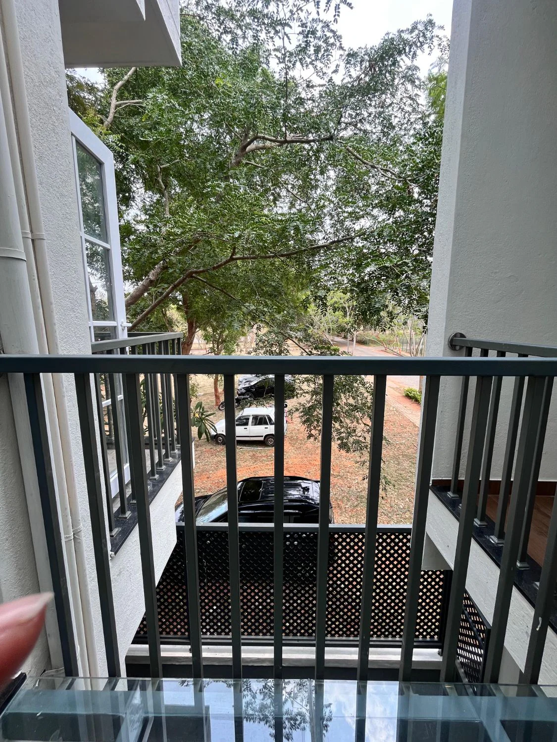 Grey Green Block, Mysuru — glass-floor balcony over the garden court