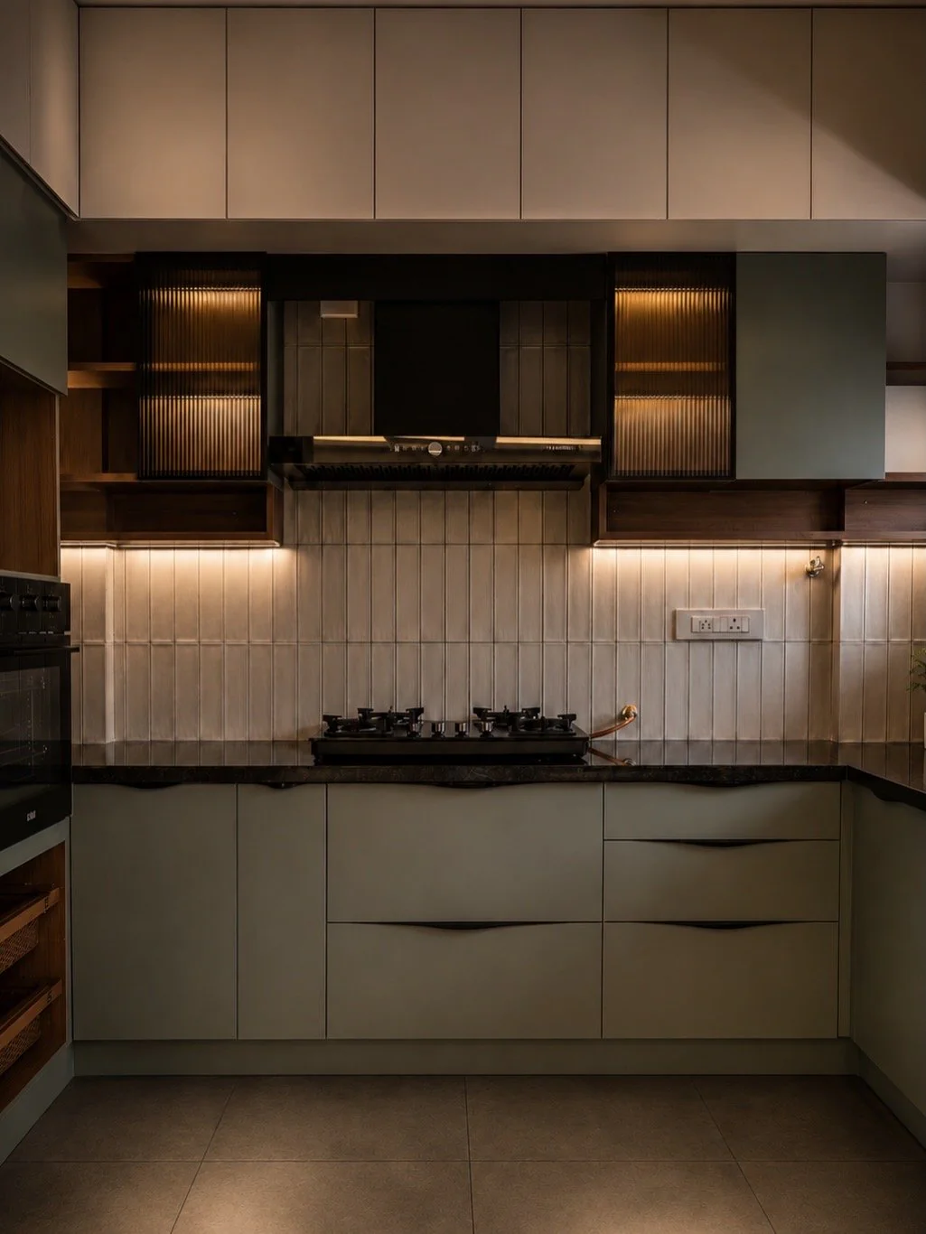 3BHK interior design, Bangalore — kitchen with reeded-glass cabinets and a dark stone counter